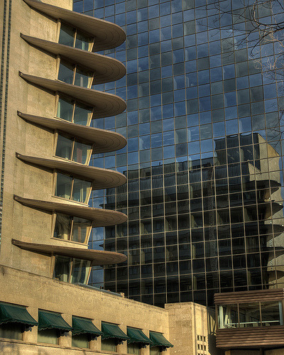 The building on the left is the Winnipeg Clinic. My parents would bring me here to visit our pediatrician. I remember elevator buttons that werent actually buttons but some sort of 1940s high-tech touch sensor. (Or is this actually a memory from The Bay?) Sitting in the waiting room I would stare out from below one of those beautifully curved awnings, fascinated by the mirrored surface of the building across the street. I searched the grid for a pattern to explain the positions of the different coloured windows.