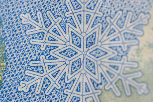 Snowflake on $5 from this Macro Currency Flickr set.