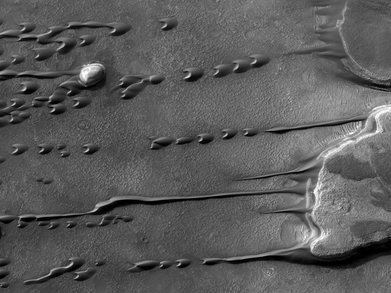 Sand dunes on Mars appear to flow and drip like a liquid.
