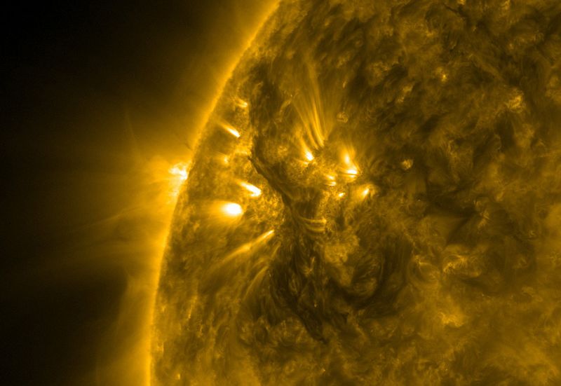 A dark solar filament seen across the surface of the sun. Related: Video of Large Eruptive Solar Prominence.