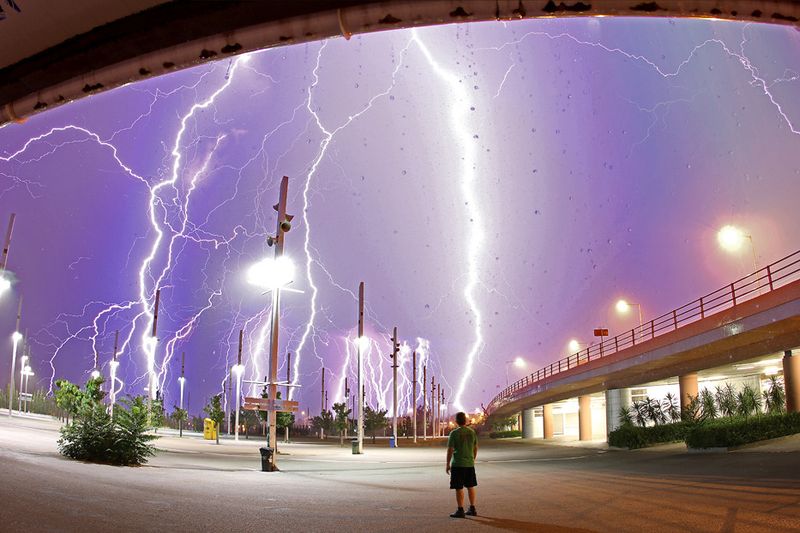 Lightning Over Athens. via 42 stacked shots taken during a lighting storm. I looked up the term stacked shots. Its like it sounds, a process of superimposing multiple images. Stacking was developed for astronomy. The purpose then was to reduce digital noise. When using film, astronomers would sometimes expose for hours at a time (occasionally, exposing the same piece of film several nights in a row, making the exposure equivalent to several days). Trying to do the same with digital would result in 100% noise, 0% image. By stacking many images of shorter duration, digital photographers can get the equivalent of a very long exposure, each of which has the noise of a shorter exposure. The signals combine in a complementary fashion, while the noise combines in ways that mostly cancels itself out. There are more advanced statistical techniques uszed that can reduce random sensor noise to virtually zero. AustinMN @ Panoramio